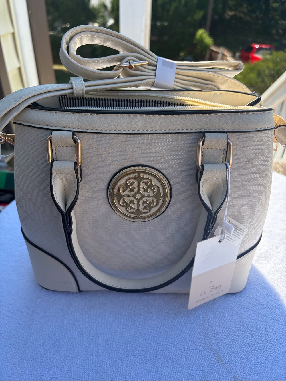 Cream Structured Satchel with Decorative Gold Medallion